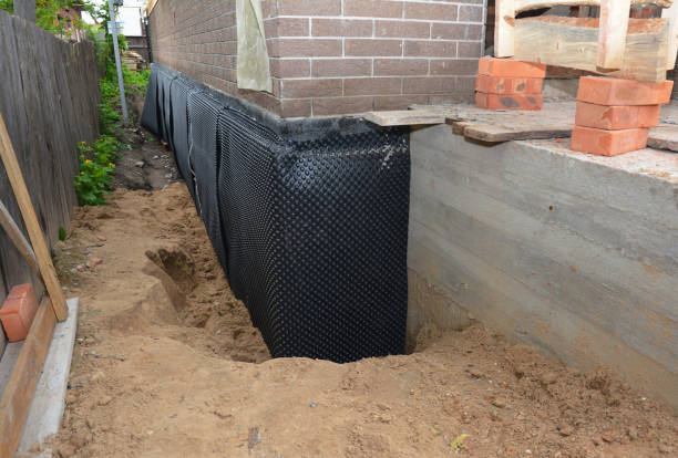 SJ Waterproofing Pros technician performing targeted Emergency Waterproofing assessment in Fayette, NY
